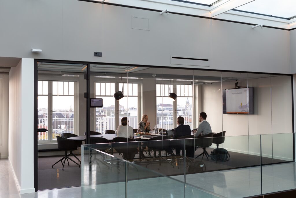 A group of people sitting around a table.